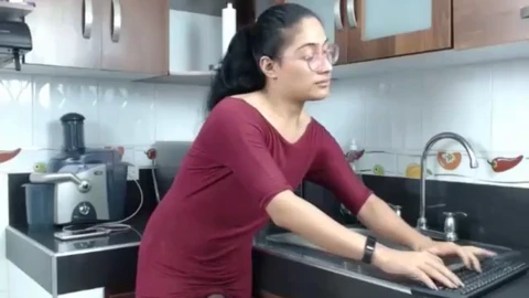 Hot Latin sissy jacks her hard cock in the kitchen